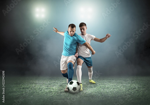 Soccer player on football field in dynamic action at summer da © Andrii IURLOV