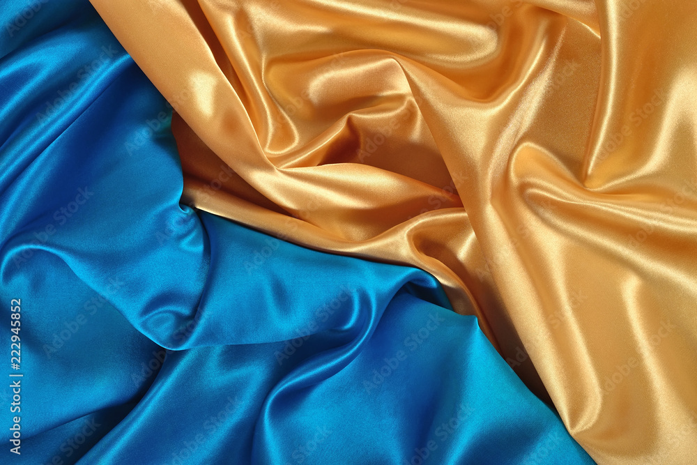 Natural golden and blue satin fabric texture Natural golden and blue satin fabric texture