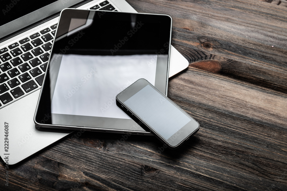 keyboard with phone and tablet pc on wooden desk keyboard with phone and tablet pc on wooden desk