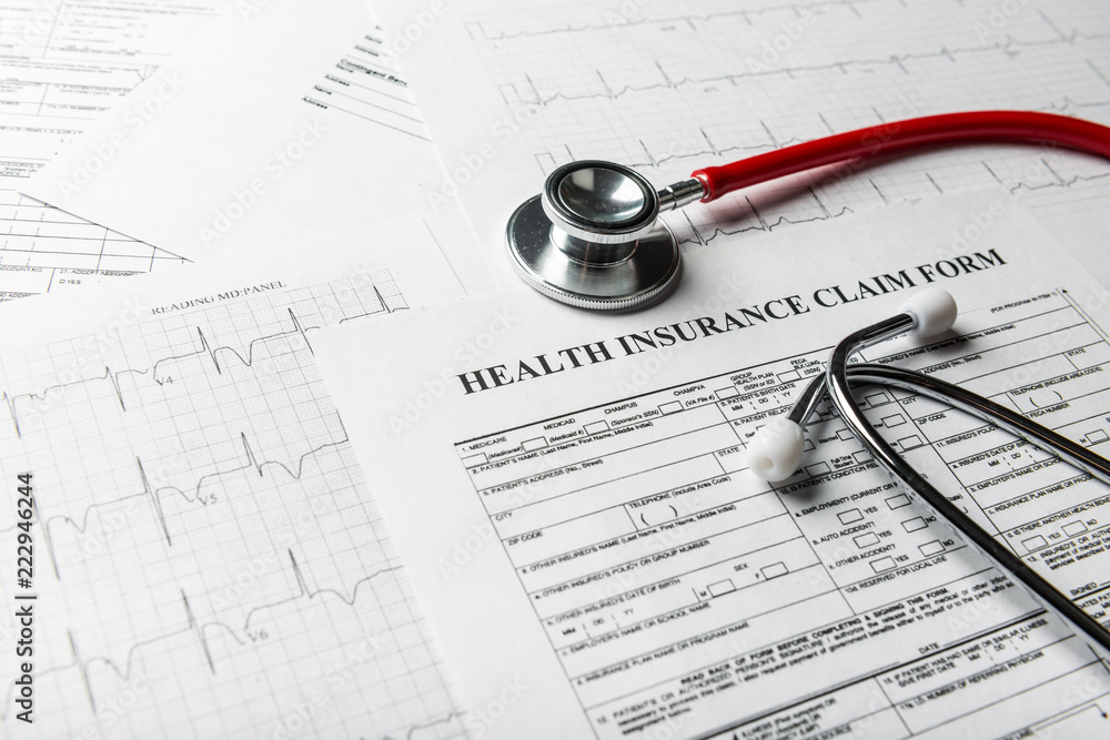 Health insurance form with stethoscope Health insurance form with stethoscope