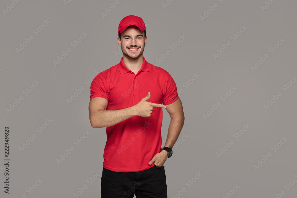 Smiling courier man posing in studio. Smiling courier man posing in studio.