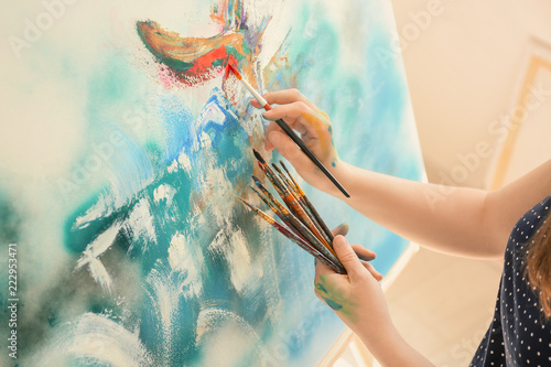 Female artist painting pict...