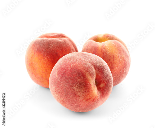 Fresh peaches on white background
