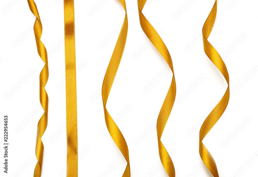 Curly golden ribbons on white background Curly golden ribbons on white background