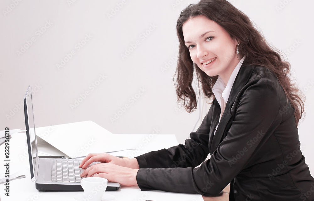 business woman working on laptop,sitting at her Desk business woman working on laptop,sitting at her Desk