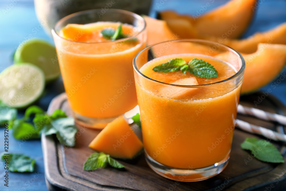 Glasses of tasty melon smoothie on table Glasses of tasty melon smoothie on table