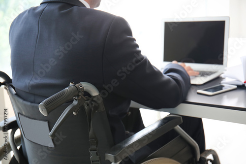 Businessman in wheelchair w...