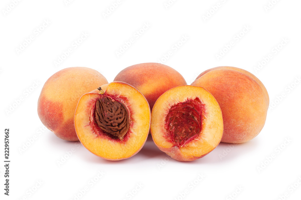 Velvet peaches whole and halves with stone on a white background isolated close up Velvet peaches whole and halves with stone on a white background isolated close up