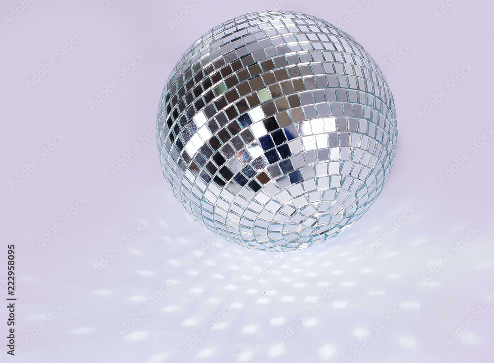 beautiful disco ball on yellow background isolated. beautiful disco ball on yellow background isolated.
