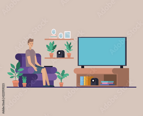 young man watching tv on the livingroom