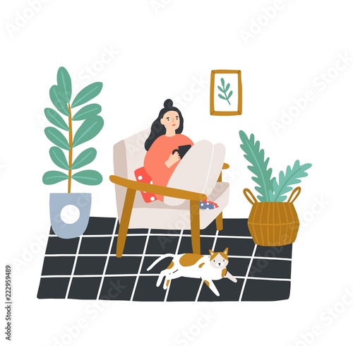 Young girl sitting in comfortable armchair and drinking tea or coffee in room furnished in Scandinavian style. Woman spending evening time at home. Colored vector illustration in flat cartoon style.