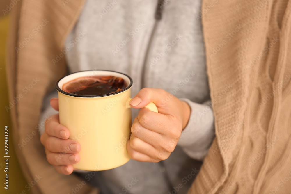 Woman holding metal cup of delicious mulled wine, closeup Woman holding metal cup of delicious mulled wine, closeup