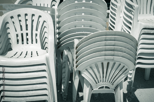 dirty old stacks of plastic chairs