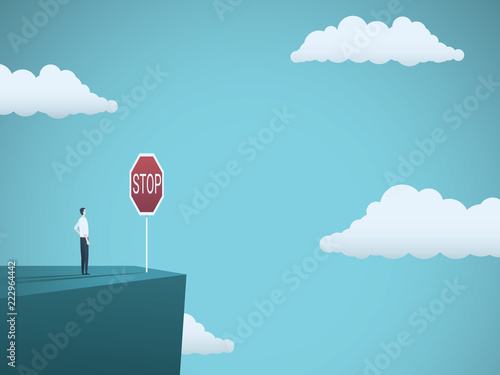 Business risk vector concept. Businessman standing on the edge of cliff with warning stop sign. Symbol of danger, failure, bankruptcy, recession and crisis.