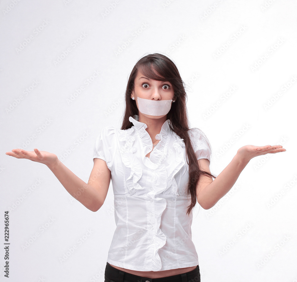 portrait of young business woman with taped mouth portrait of young business woman with taped mouth