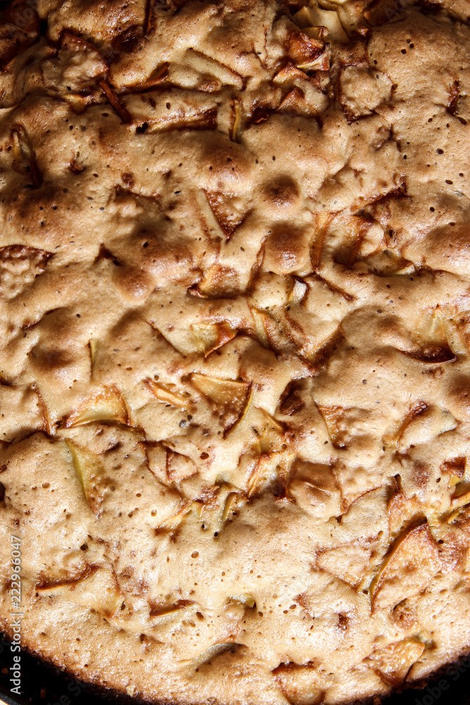 baked pie with apples in a frying pan