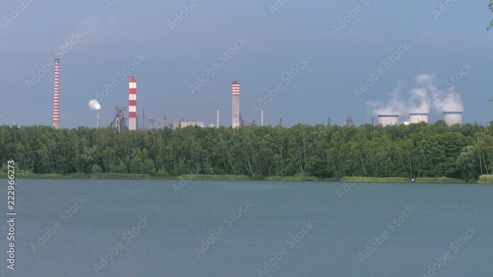 Coal plant on the shores of the lake. Smoke rises into the sky. Tall chimneys. Air pollution. Panning, Coal plant on the shores of the lake. Smoke rises into the sky. Tall chimneys. Air pollution. Panning,