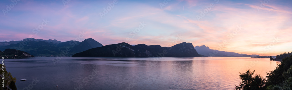 Large magnificent  panorama  extra wide.  XL Switzerland. Large panorama of Lake Lucerne. Mountains in the evening sunset. In the background city of Lucerne.