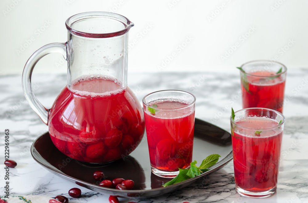 Fresh cranberry drink on marble background. Fresh cranberry drink on marble background.