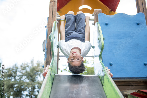 Child Playing on the park slide
