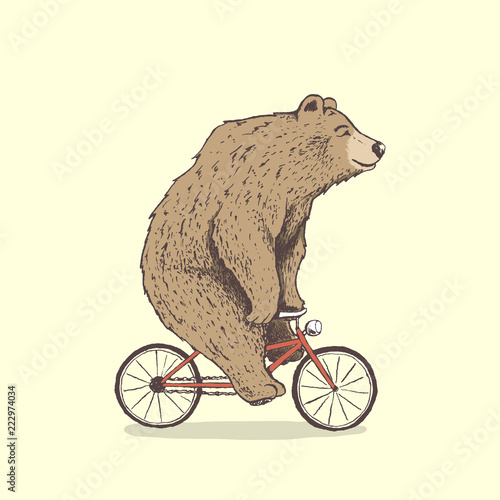 bear is riding a bicycle.Hand drawn style.Vector illustration