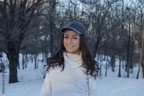 Beautiful woman posing in winter park