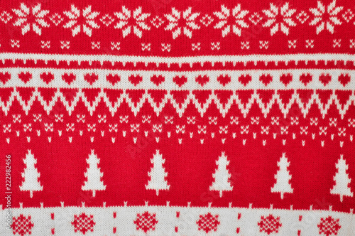 Element decor Christmas red knitted sweater close-up. Holiday gift. Backgdound