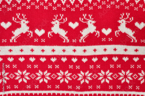 Element decor Christmas red knitted sweater close-up. Holiday gift. Backgdound