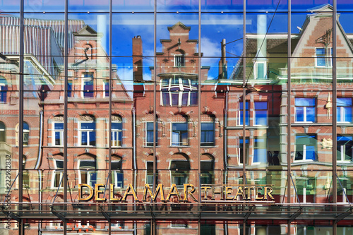 Facade with reflection of the DeLaMar theater in Amsterdam, The Netherlands

