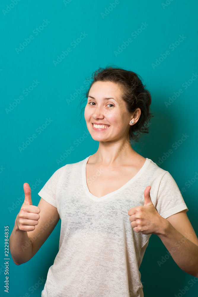 beautiful brunette girl showing thumbs up beautiful brunette girl showing thumbs up