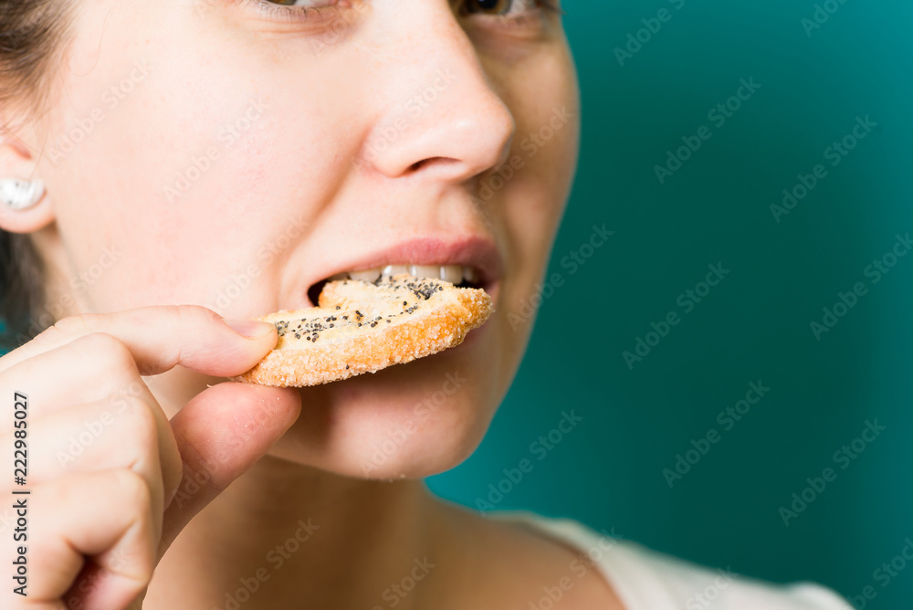 beautiful brunette girl eat cookie