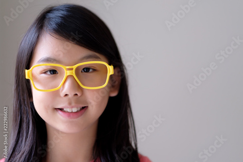 Wallpaper Mural Portrait of Asian teenager girl with big yellow glasses Torontodigital.ca