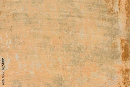 texture of old peeling yellow plaster