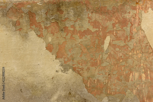 texture of old peeling yellow plaster