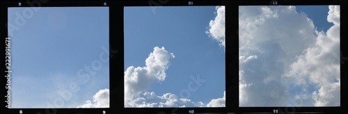 Triple vintage film strip frame with blue sky and clouds.