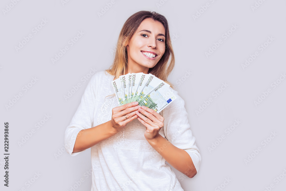 Woman young adult happy and emotional with a fan of European Euro money in the Studio Woman young adult happy and emotional with a fan of European Euro money in the Studio