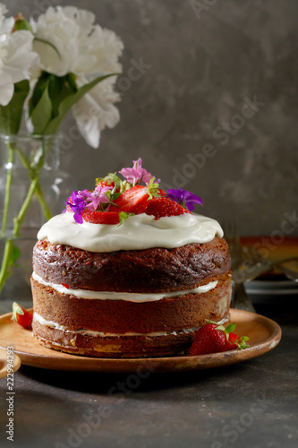 Rustic cake with cream and berry