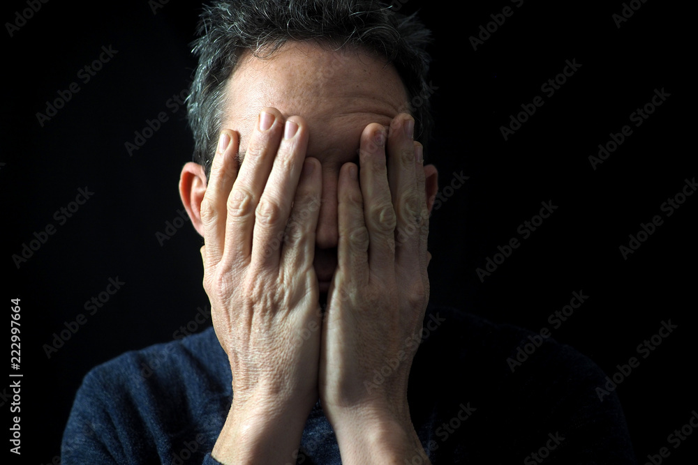 Man's portrait with dramatic light, black background Man's portrait with dramatic light, black background
