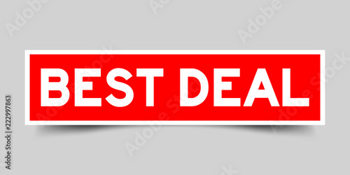 Red sticker with word best deal on gray background
