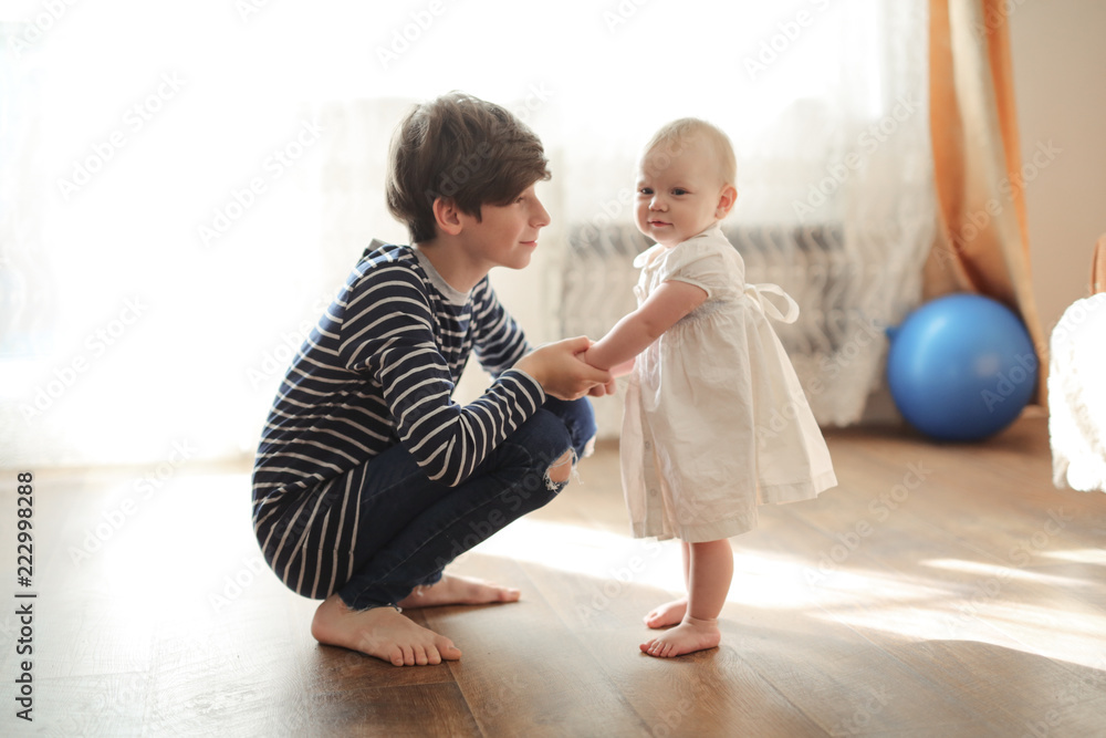 elder brother cares with little sister Toddler elder brother cares with little sister Toddler