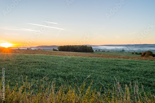 View of the prairies of Gaume at sunrise in southern Belgium