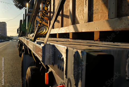 Bild auf Leinwand A big rig with a crated load on its flat bed.