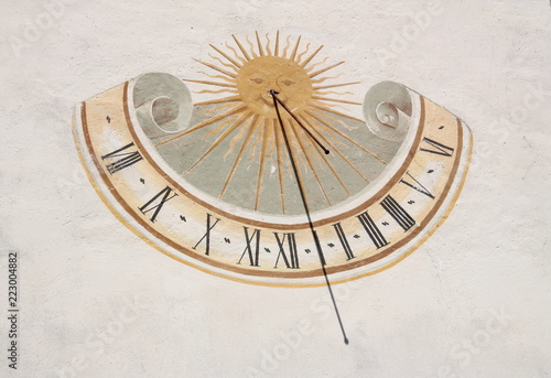 Vertical sundial on a building facade
