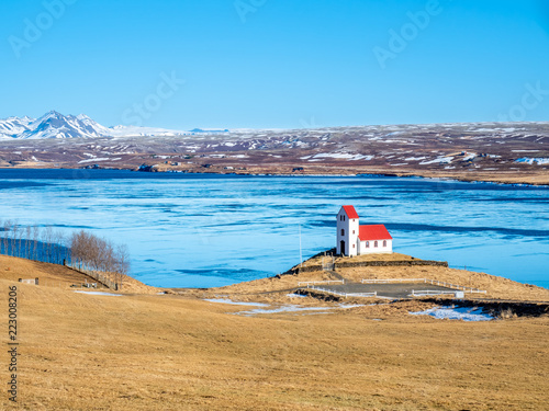 Ulfljotfvatnskirkja, church on lake, Iceland photo