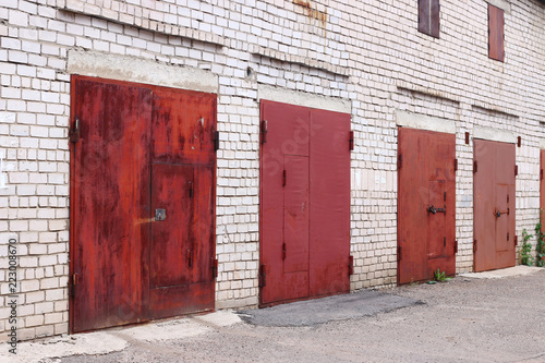 Red garage door. old and rutic. ugly doors