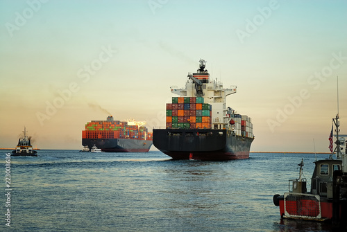 Fully loaded container ships exiting the Los Angeles harbor