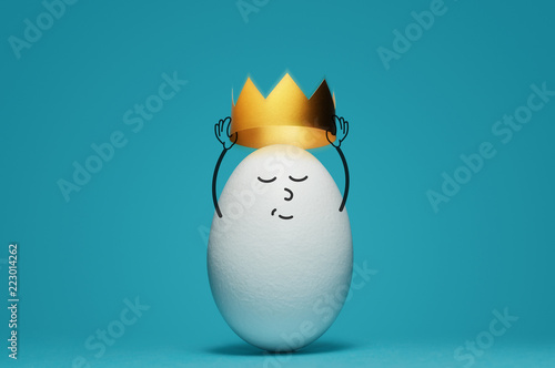 Bild auf Leinwand A white egg is dressing a gold crown on blue background