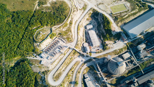 Aerial view of cement manufacturing plant. Concept of buildings at the factory, steel pipes, giants.