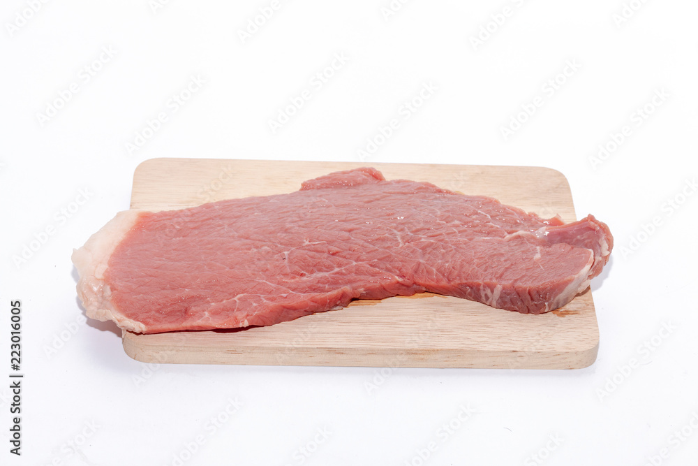 Fototapeta premium close up of raw beef top side on wooden board