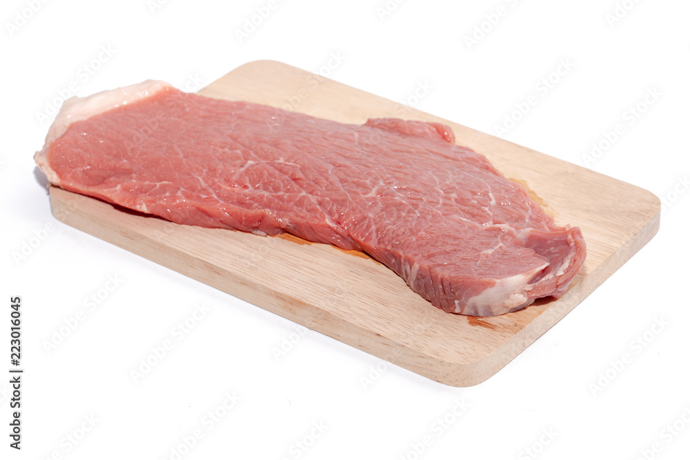 close up of raw beef top side on wooden board close up of raw beef top side on wooden board